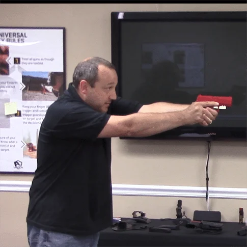 extending the firearm towards the target